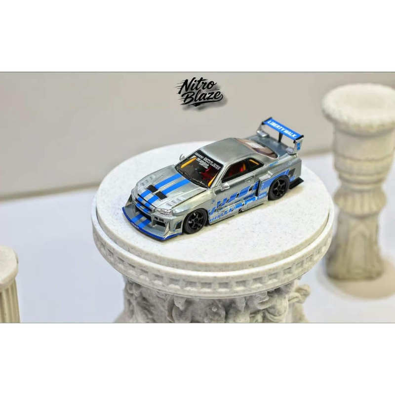*PRE-ORDER* Nissan Skyline R34，ER34 Super Silhouette (Open-Hood, Visible Engine) Raw Silver-Blue, 1:64 Scale — image 1