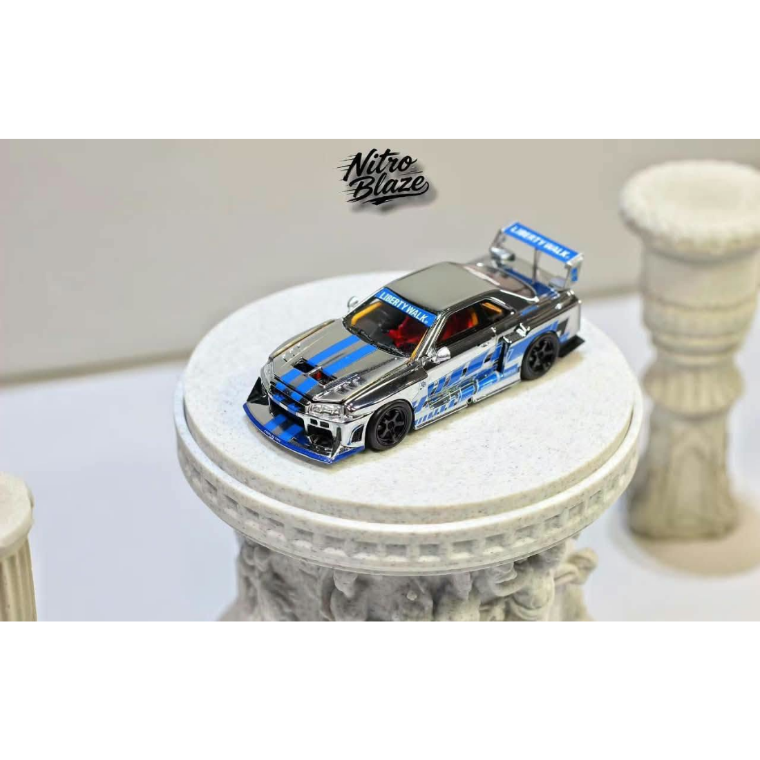 *PRE-ORDER* Nissan Skyline R34，ER34 Super Silhouette (Open-Hood, Visible Engine) Chrome Silver-Blue, 1:64 Scale — image 1